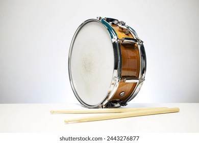 drum in brown isolated on white background with drum sticks  - Powered by Shutterstock