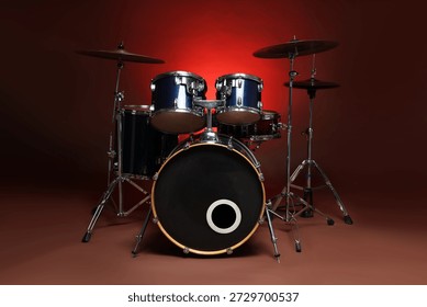 Drum kit on red gradient background. Musical instruments