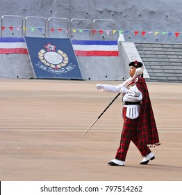 A Drum Major Of Hong Kong Police Military Band  Holding A Sceptre And Marching At Hong Kong Police College , 
During The New Police  Recruits Passing Out Parade On 24 Jan 2015 In Hong Kong .