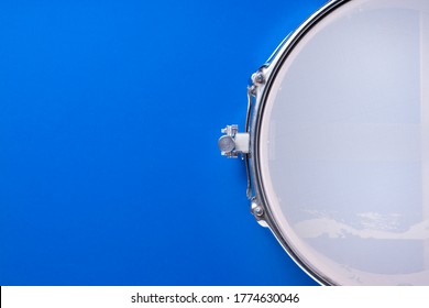 Drum on blue table background, top view, music percussion concept