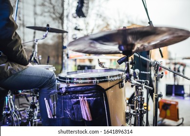 Drum set in close up view on stage, drummer playing set on stage 