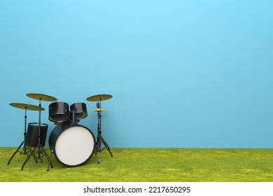 A Drum Set On A Blue Background And Grass Carpet.