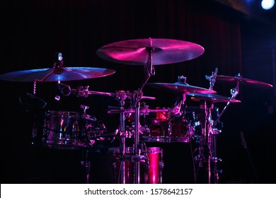 Drum set on rock concert stage.Professional musical instruments for drummer musician.Classic analog audio equipment for metal band live performance.Drumming instrument on rock festival