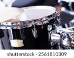 Drum set, selective focus on blurred background in studio.