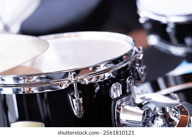 Drum set, selective focus on blurred background in studio.