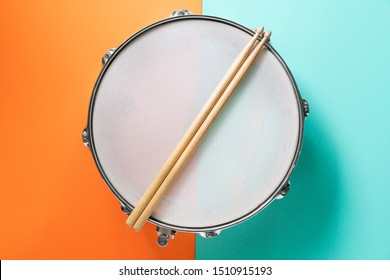 Drum Stick On Color Table Background, Top View, Music Concept