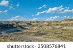 Drumheller, Alberta, Canada - August 06 2024: Area of the badlands as viewed from the viewing platform near the Royal Tyrrell Museum in Drumheller, Alberta.