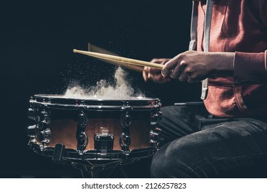 The Drummer Plays With Mallets On Floor Tom In Dark Room.