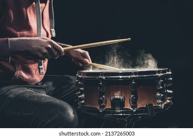 The Drummer Plays With Mallets On Floor Tom In Dark Room.