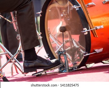 drummer's foot is on the pedal and beats the drum - Powered by Shutterstock