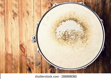 Drums conceptual image. Picture of snare drum lying on wooden background. Retro vintage instagram picture. - Powered by Shutterstock