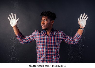 Drunk African American Afro Businessman Sloppy Man With Dreadlocks Hands Up Soiled In White Powder Dust Chemical Drug Police Arrest Cuba On A Black Background In The Studio.surrenders To The Police