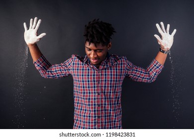 Drunk African American Afro Businessman Sloppy Man With Dreadlocks Hands Up Soiled In White Powder Dust Chemical Drug Police Arrest Cuba On A Black Background In The Studio.surrenders To The Police