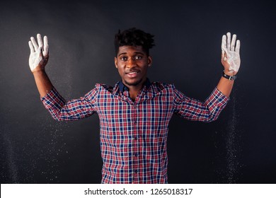 Drunk African American Afro Businessman Sloppy Man With Dreadlocks Hands Up Soiled In White Powder Dust Chemical Drug Police Arrest Cuba On A Black Background In The Studio.surrenders To The Police