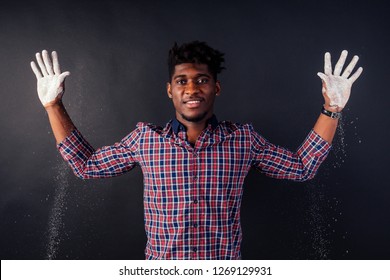 Drunk African American Afro Businessman Sloppy Man With Dreadlocks Hands Up Soiled In White Powder Dust Chemical Drug Police Arrest Cuba On A Black Background In The Studio.surrenders To The Police