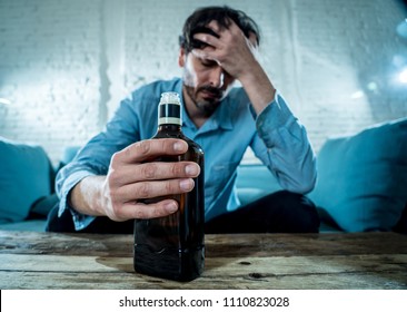 Drunk Alcoholic Lain Business Man Drinking Whiskey From The Bottle And Glass Depressed Wasted And Sad At Home Couch In Alcohol Abuse And Alcoholism Concept