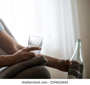 Drunk Alcoholic Lain Business Man Drinking Whiskey From The Bottle And Glass Depressed Wasted And Sad At Home Couch In Alcohol Abuse And Alcoholism Concept
