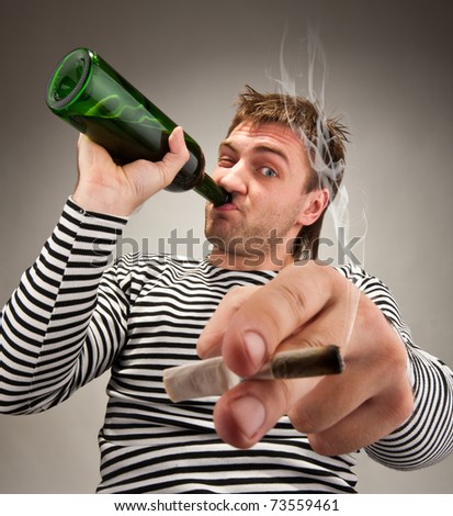Drunk bizarre sailor with bottle and cigarette