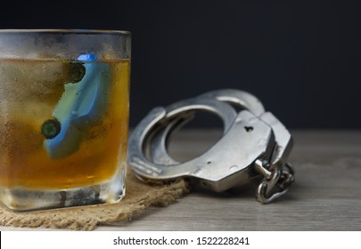 Drunk Driving Concept.car In Glass Of Whisky.