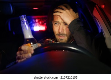 Drunk man driving car. Police stopped driver under alcohol influence - Shutterstock ID 2139210155