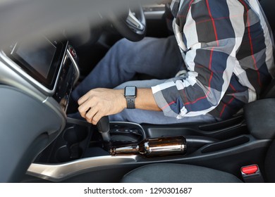 Drunk Man Falling As Sleep While Driving A Car With Alcohol Bottle Beside (drink Not Drive Concept)