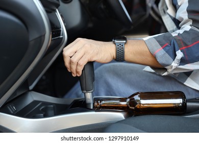 Drunk Man Falling As Sleep While Driving A Car With Alcohol Bottle Beside (drink Not Drive Concept)