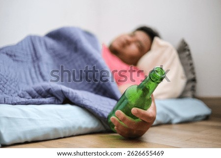 Drunk Man Lying on The Bed and Sleeping After Drinking Lots of Alcohol