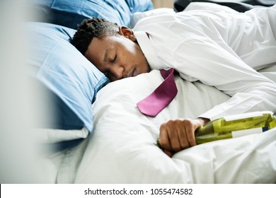 A Drunk Man Passing Out In Bed