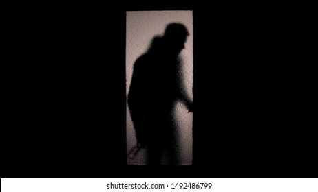 Drunk Man Silhouette With Bottle Coming Home, Opening Glass Door, Alcoholism