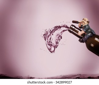 A Drunk Man Sitting Of A Wine Bottle Imagining An Illusion Of A Fish Made Of Wine Spilling Out Of The Bottle.