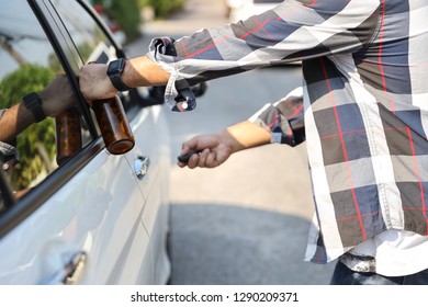 Drunk Man Try Opening Vehicle With Car Key While Holding Alcohol Bottle In Another Hand (drink Not Drive Concept)