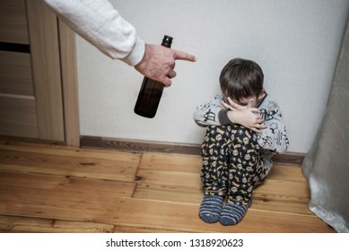 Drunk Parent And Little Scared Son. Violence Against Children Concept. Aggression In The Family. Alcohol Abuse. Domestic Violence