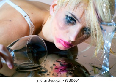 Drunk woman with drinking glass
