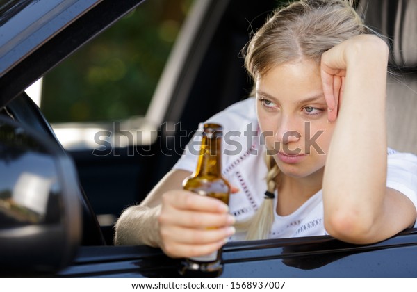 Drunk Woman Driving Holding Beer Bottle Stock Photo 1568937007 ...