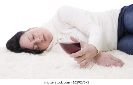 drunk woman falling asleep about to spill red wine from glass onto carpet