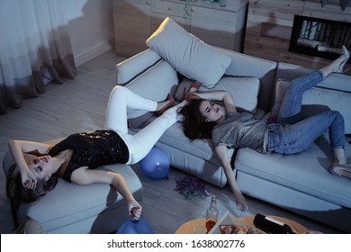 Drunk women sleeping in messy room after party