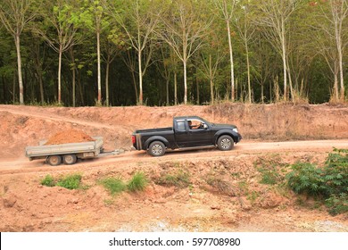 Drving Soil Out From The Place By Using Excavator And Car Trailer.