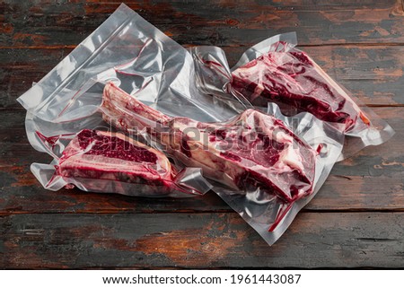 Similar – Dry aged raw tomahawk beef steak isolated on white background