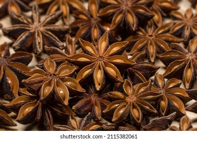 Dry anise stars on wooden table. Anise stars close up background
