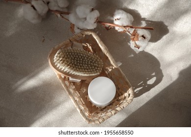 Dry Anti-cellulite Massage Brush On A Textured White Tube Background. Beauty Concept.