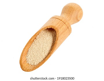 Dry Baking (Bakers) Yeast Granules In A Scoop. Raising Agent. Isolated On White.