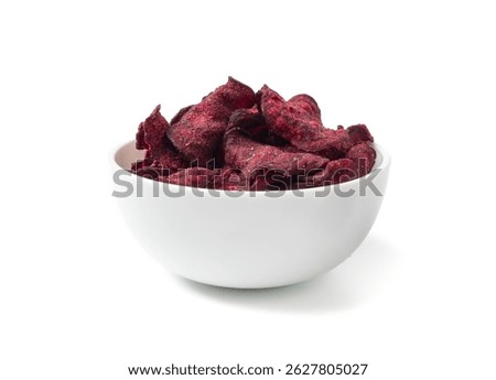Dry beetroot chips isolated, dried sliced red beet flakes pile, beet root pieces and chips, dehydrated deep fried vegetable root heap on white background