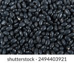 Dry black beans textured background