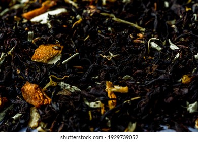 Dry Black Tea Leaves With Pieces Of Dried Citrus Peel, Fruit And Flowers. Close Up Tea Background Background.