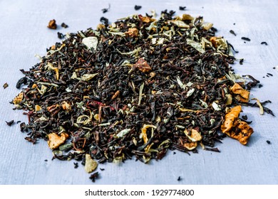 Dry Black Tea Leaves With Pieces Of Dried Citrus Peel, Fruit And Flowers. Close Up Tea Background Background.