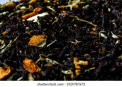 Dry Black Tea Leaves With Pieces Of Dried Citrus Peel, Fruit And Flowers. Close Up Tea Background Background.