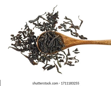Dry Black Tea Leaves In Wooden Spoon Isolated On A White Background, Top View.