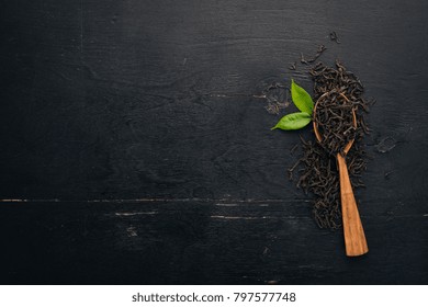 Dry Black Tea. On A Wooden Background. Top View. Copy Space.