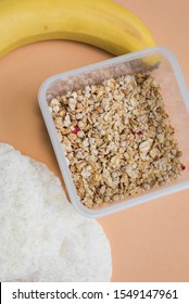 Dry Breakfast Of Instant Porridge, Light Bread And Banana On A Beige Background. Vertical Photo, Top View, Flat Lay.