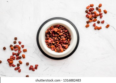 Dry Cat Food In Bowl On White Stone Backgorund Top View Copy Space